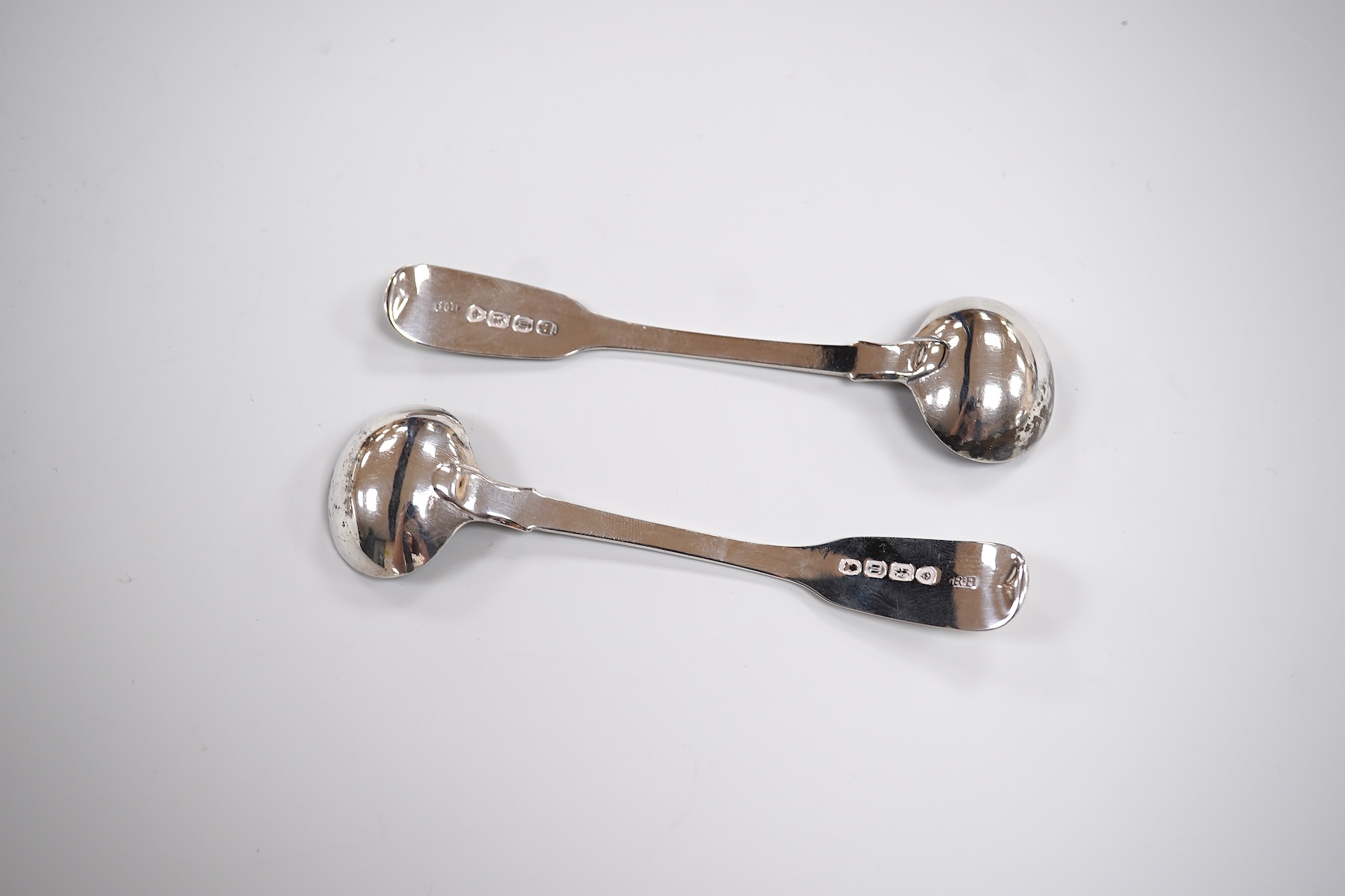 A pair of early Victorian silver cauldron salts, by John Tapley, London, 1838, with later blue glass liners, diameter 94mm, together with a pair of George IV silver Old English pattern condiment spoons, London, 1828.